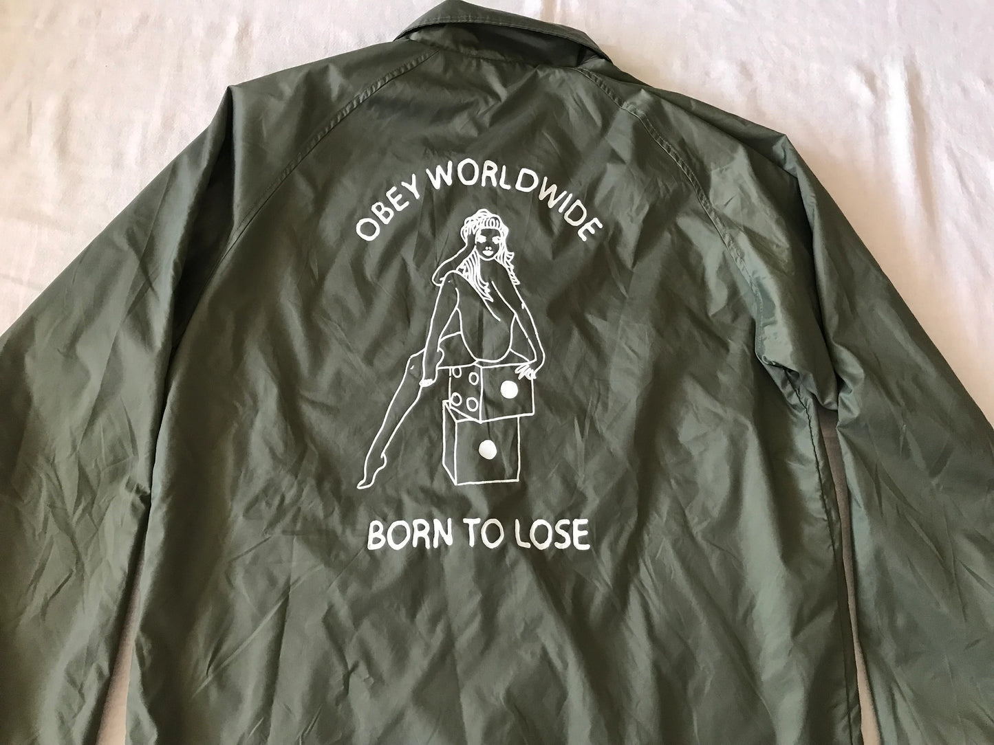 OBEY CLOTHING ''OBEY WORDWIDE'' MEN'S  WINDBREAKER LIGHT JACKET OVERSHIRT SNAP BUTTONS DRAB W/ GRAPHIC PRINT MEDIUM