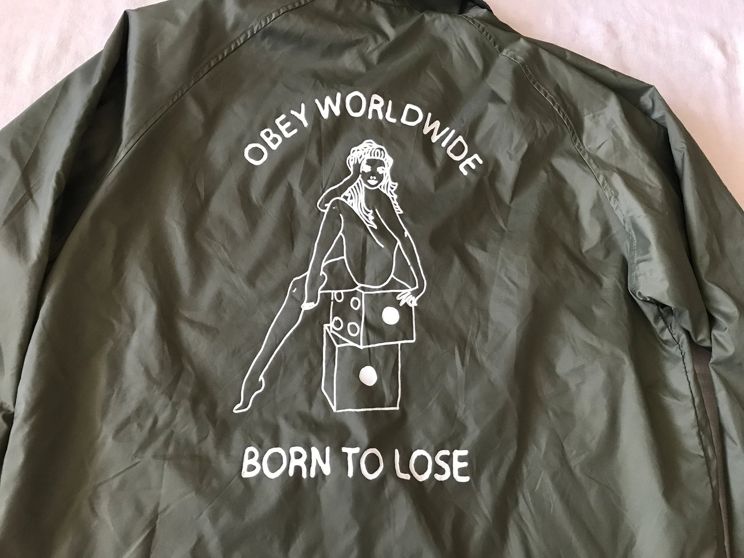 OBEY CLOTHING ''OBEY WORDWIDE'' MEN'S  WINDBREAKER LIGHT JACKET OVERSHIRT SNAP BUTTONS DRAB W/ GRAPHIC PRINT MEDIUM