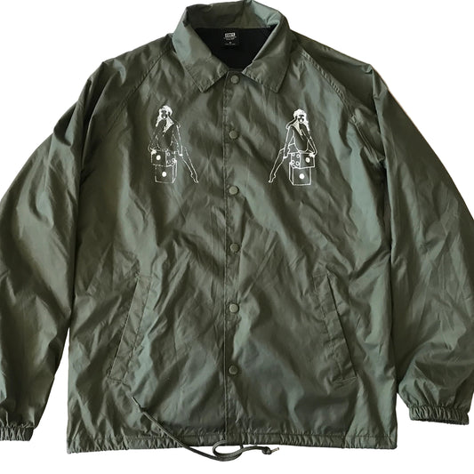 Green jacket with embroidered designs on a white background